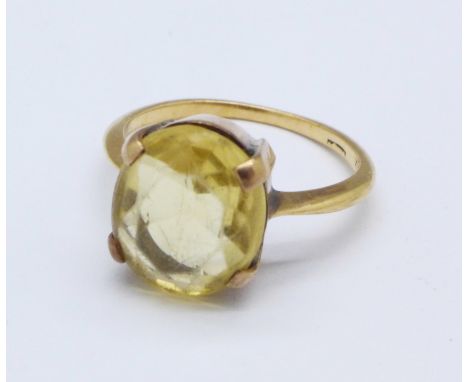 A yellow metal and citrine ring, tests as 14/15ct, 4.3g, Q