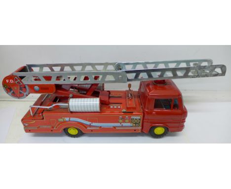 A 1960's battery powered Japanese tin plate fire engine