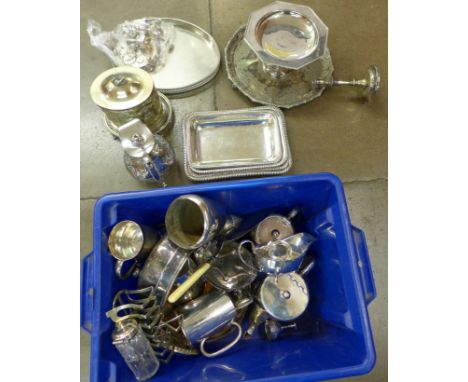 A box of silver plated items, candlesticks, tray, serving dishes, tea caddy, etc.