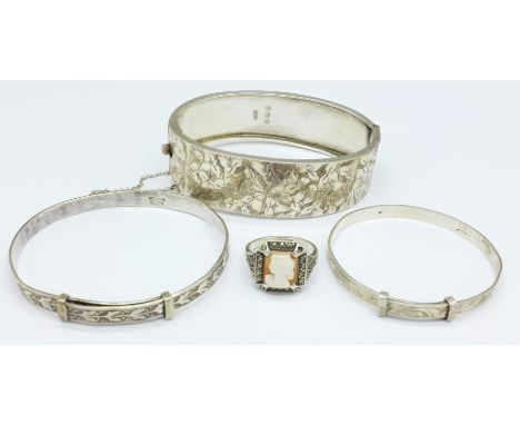 Three silver bangles including one with Victorian hallmark and a ring