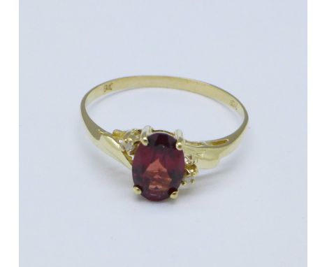 A 9ct gold, garnet and diamond ring, 1.1g, O