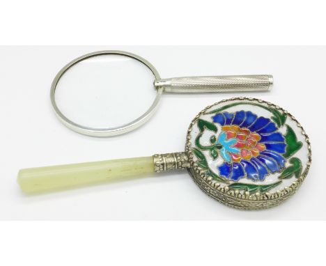 A silver mounted magnifying glass and an enamel backed hand mirror