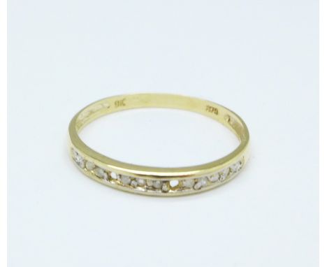 A 9ct gold and diamond ring, 0.7g, O, lacking two stones