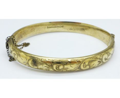 A silver gilt bangle