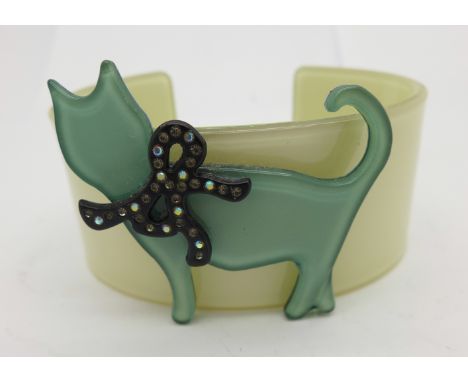 A lucite cat bangle, height of cat 44mm