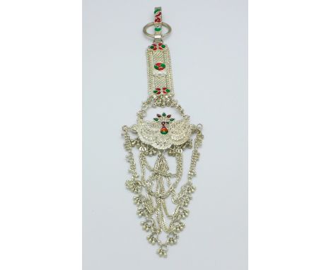 An Eastern white metal and enamel wedding jewel, tests as silver, 55.1g