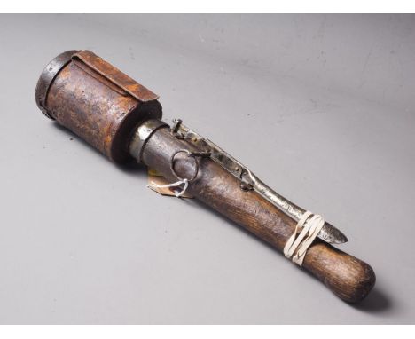 An inert WWI German stick grenade with side spring release 