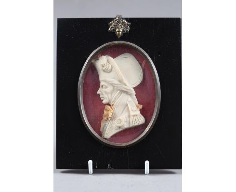 A carved wax portrait cameo of Admiral Nelson, 3 3/4" high, in ebonised frame 