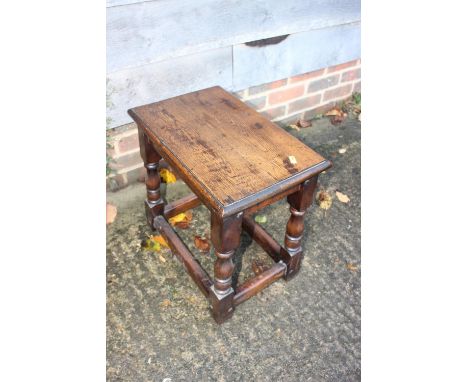 An oak joint stool of 17th century design, on turned and stretchered supports, 18" wide x 11 1/2" deep x 17 1/2" high, and&nb