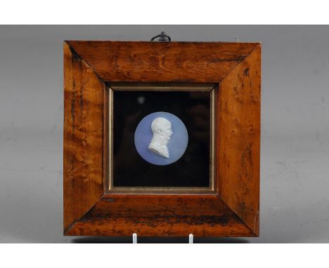 A 19th century bisque porcelain cameo portrait of Napoleon, 2 1/8" dia (restored), in maple frame 