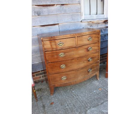 A 19th century mahogany and ebony line inlaid bowfront chest of two short and three long drawers, on splay bracket feet, 41" 