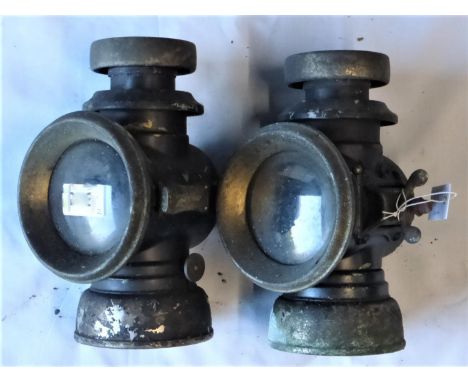A Pair of Lucas F141 Oil Lamps. In sound condition with component parts insitu, brass bodies with black enamel, in need of re