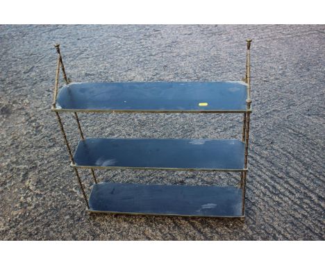 A faux bamboo brass three-tier wall shelf, 24" wide x 6" deep x 27" highCondition:Some of the metalwork framing is corroded.T