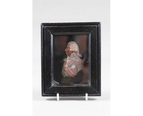 After John de Vaere, a 19th century coloured wax portrait of Admiral Nelson, 2 3/4" high, in ebonised frame 