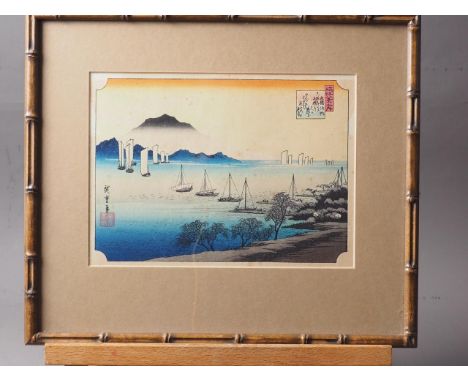 Utagawa Hiroshige: a Japanese wood block print, "Fishing Boats returning to Yabase", in faux bamboo strip frame, and a compan