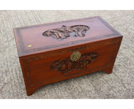 A Chinese carved camphor wood chest, on bracket feet, 37" wide x 17 1/2" deep x 20" high 