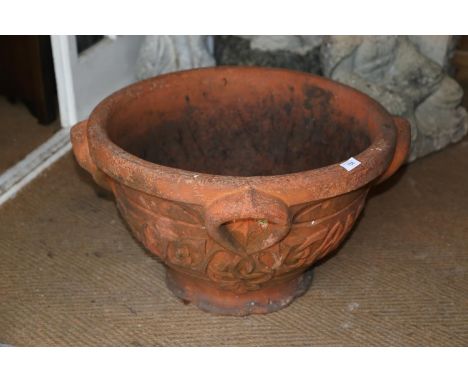 An Art Nouveau terracotta relief decorated planter, 15 1/4"h x 26" diaCondition:The base of the pot has numerous deep chips, 