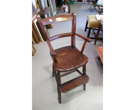 19th Century child's elm and beech highchair on turned supports, together with a similar bow shaped child's chair with commod