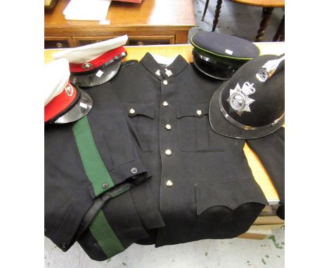 Intelligence Corps suit jacket and hat, two military peaked hats and a policeman's helmet 