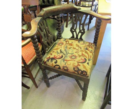 19th Century oak pierced splat back and bobbin turned corner elbow chair, with drop-in seat on turned supports with stretcher