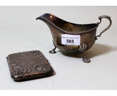 Birmingham silver helmet shaped cream jug on decorative supports with C-scroll handle by Walker & Hall, and a silver card cas
