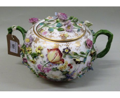 19th Century German floral encrusted porcelain two handled sucrier and cover, painted with panels of flowers and landscapesSo