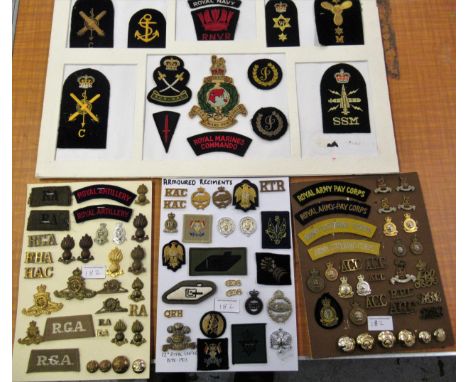 Four cards mounted with various British Army and other cloth and metal badges 