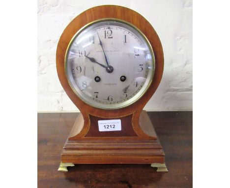 Edwardian mahogany and line inlaid balloon shaped mantel clock, the silvered dial with Arabic numerals signed Hamilton & Inch
