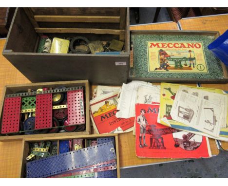 Small painted pine trunk containing a collection of miscellaneous early Meccano 