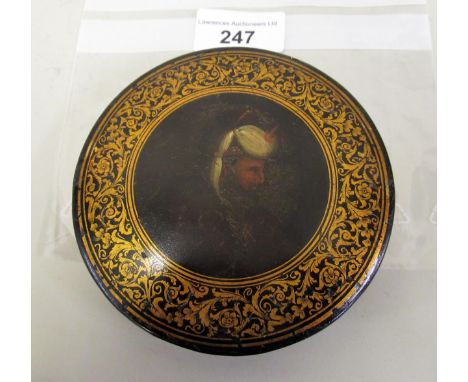 19th Century circular papier mache snuff box, the cover painted with portrait of a TurkSome losses to paint and gilt. Small c