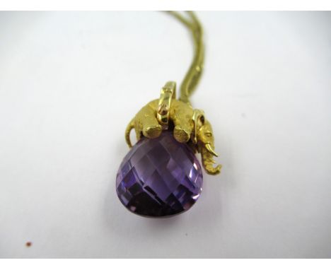High carat yellow metal diamond set and amethyst mounted pendant in the form of an elephant, on a 18ct gold chain, 10g gross 