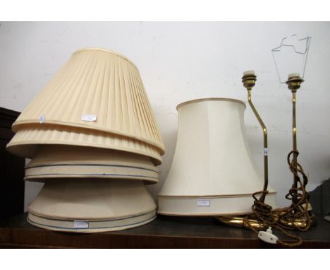 Pair of giltwood and brass table lamp mounts together with a quantity of various lamp shades 