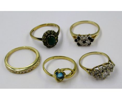 Four various 9ct gold dress rings together with a 14ct gold cubic zirconia set dress ring, 13g 