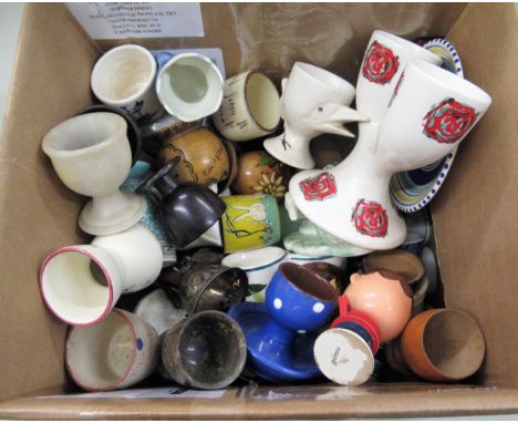 Large collection of various ceramic and other egg cups 