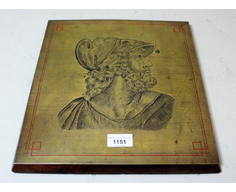 Antique engraved brass printing plate of a Greek warrior wearing a helmet, 34cms x 32cms, mounted on a mahogany board, togeth