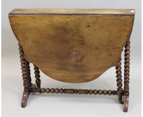 Victorian walnut Sutherland table, the shaped top with bobbin turned supports and stretchers, 90cms wide 