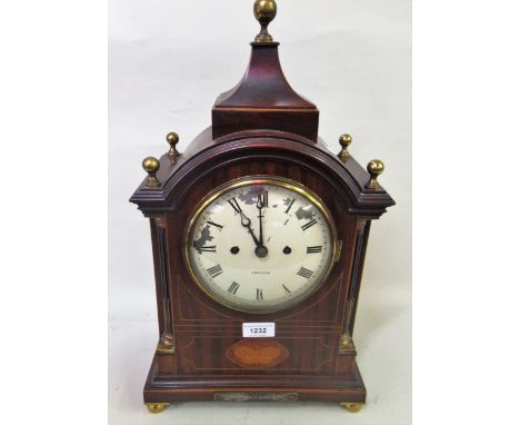 Edwardian mahogany inlaid and brass mounted bracket clock, the broken arch case with ball finial surmounts, the circular pain