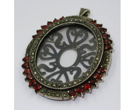 Silver garnet and marcasite mounted oval portrait pendant 