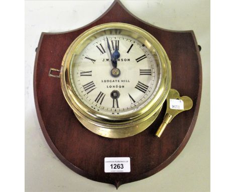 J.W. Benson, small brass cased bulkhead clock, the painted dial with Roman numerals and single train movement, mounted on a m