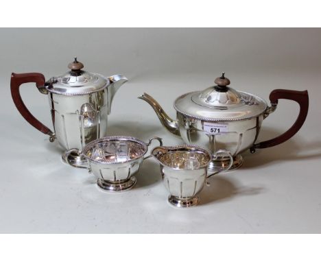 Birmingham silver four piece tea service of circular faceted design with Bakelite handles, overall weight 39 troy ounces 