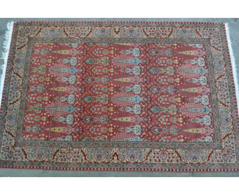 Sparta carpet with all-over stylised floral and vase design on a pink ground296cms long x 202cms wide 