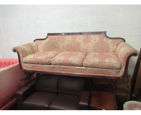 20th Century regency style mahogany three seat sofa, with carved reeded back rail on carved claw front supports, with scroll 