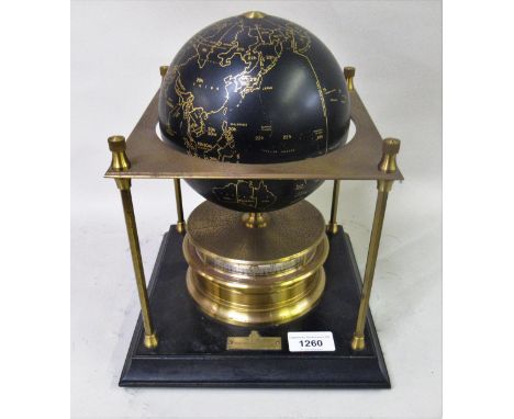 Royal Geographical Society World clock with gilt and black japanned decoration on a wooden stand, 1980, 28cms high x 23cms sq