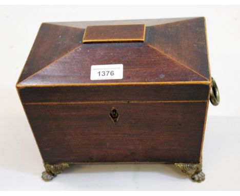 Regency mahogany line inlaid and brass mounted sarcophagus shaped tea caddy, the hinged cover enclosing an interior caddy and