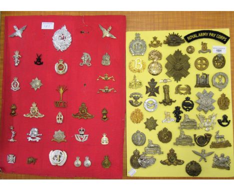 Two cards mounted with various British Army metal and cloth badges 