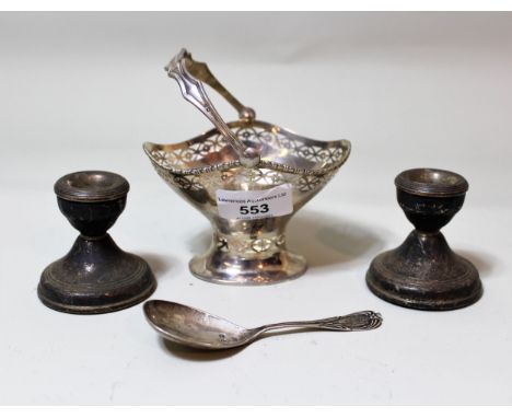 Small Birmingham silver sugar basket with swing handle, together with a silver caddy spoon and a pair of silver dwarf candles