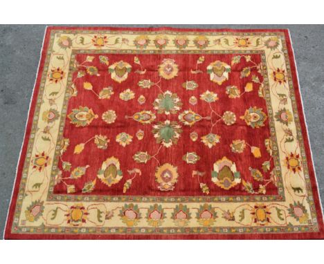 Afghan Ziegler design carpet with an all-over palmette pattern on a rose ground with ivory ground borders, 290cms x 251cmsHan