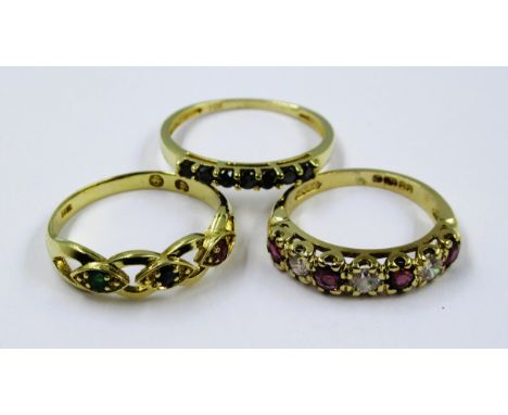 Continental gold ring set with ruby, sapphire and emerald, 1.9g, together with two 9ct gold half hoop rings, 5.1g 