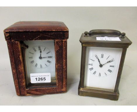 20th Century gilt brass cased carriage clock, the enamel dial with Arabic numerals in a leather case, together with another 2