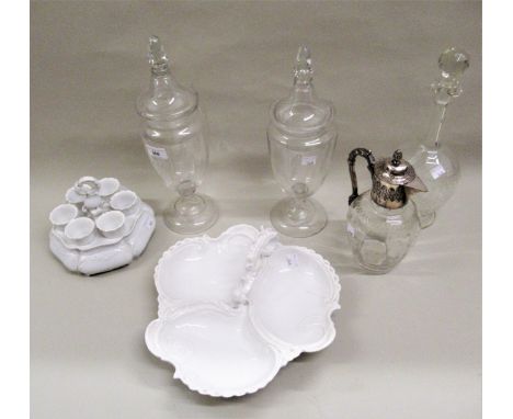 Pair of glass ovoid bonbon jars with covers, 36cms high together with a porcelain egg cup set, trefoil dish, glass claret jug